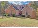 Beautiful brick home with manicured lawn, landscaping, and a welcoming front entrance at 20 Balfour Dr, Covington, GA 30014