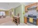 Open-concept kitchen includes stainless steel appliances, wood cabinets and access to dining and living area at 20 Balfour Dr, Covington, GA 30014
