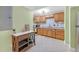 Efficient kitchen with wood cabinets, granite countertops, and modern appliances for a cozy cooking space at 20 Balfour Dr, Covington, GA 30014