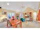 Open concept living room and dining area with vaulted ceiling and brick fireplace at 20 Balfour Dr, Covington, GA 30014