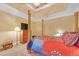 Main bedroom with tray ceiling, decorative columns, and a comfortable king-size bed at 20 Balfour Dr, Covington, GA 30014