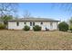 View of home's rear exterior showcasing the backyard and potential for landscaping at 2265 Starline Dr, Decatur, GA 30032