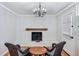 Living room showcasing a painted brick fireplace with a wood mantle and hardwood floors at 2265 Starline Dr, Decatur, GA 30032