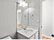 Bright bathroom featuring a white sink, toilet, and modern fixtures at 4606 Liberty Square Dr, Acworth, GA 30101