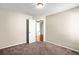 Empty bedroom showcases carpet flooring and an open door at 4606 Liberty Square Dr, Acworth, GA 30101