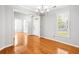 Dining room features hardwood floors, neutral walls, and views of the entry and front yard at 4606 Liberty Square Dr, Acworth, GA 30101