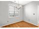 Bright dining area with natural light, hardwood floors, and an elegant chandelier at 4606 Liberty Square Dr, Acworth, GA 30101