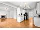 Open-concept kitchen with an island, stainless steel appliances, and hardwood floors at 4606 Liberty Square Dr, Acworth, GA 30101