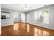Bright living area features hardwood floors, kitchen view, and a large window with outdoor views at 4606 Liberty Square Dr, Acworth, GA 30101