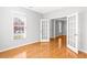 Office features hardwood floors, neutral walls, natural light, and glass French doors at 4606 Liberty Square Dr, Acworth, GA 30101