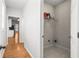 Hallway featuring an entry to a storage room with a shelf and tile floors at 4606 Liberty Square Dr, Acworth, GA 30101