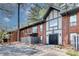 Charming townhome with brick facade, private balconies, and manicured landscaping in a desirable neighborhood at 6851 Roswell Rd # A21, Sandy Springs, GA 30328