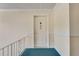 Hallway with teal carpet, white walls, and unit 21 apartment door at 6851 Roswell Rd # A21, Sandy Springs, GA 30328