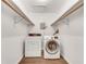 A laundry room featuring a washer and dryer and shelving at 6851 Roswell Rd # A21, Sandy Springs, GA 30328