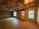 Unfinished basement with two windows and a door for backyard access at 6893 Spring Valley Ct, Douglasville, GA 30135