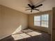 A bedroom with carpet, a ceiling fan, and natural light shining through the windows at 6893 Spring Valley Ct, Douglasville, GA 30135