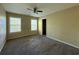 This carpeted bedroom has two windows, a ceiling fan, and a closet for your belongings at 6893 Spring Valley Ct, Douglasville, GA 30135