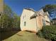 Two-story home featuring vinyl siding, a mix of stone facade, and well-maintained lawn at 6893 Spring Valley Ct, Douglasville, GA 30135