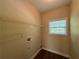 Small laundry room with white wire shelving and a window at 6893 Spring Valley Ct, Douglasville, GA 30135