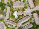 Aerial view of a planned community with lush landscaping and community pool at 1261 Ashford Creek Ne Park, Brookhaven, GA 30319
