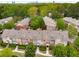 Aerial view of townhomes surrounded by lush trees and greenery at 1261 Ashford Creek Ne Park, Brookhaven, GA 30319