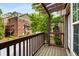 Private balcony overlooking the street, with natural wood decking and privacy fence at 1261 Ashford Creek Ne Park, Brookhaven, GA 30319