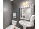 A stylish half bathroom featuring modern fixtures and a sleek design at 1261 Ashford Creek Ne Park, Brookhaven, GA 30319