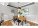 Dining area with hardwood floors, modern decor, and stylish light fixtures at 1261 Ashford Creek Ne Park, Brookhaven, GA 30319