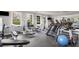 Well-equipped gym with treadmills, weight machines, and ample natural light at 1261 Ashford Creek Ne Park, Brookhaven, GA 30319