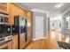 Bright kitchen with stainless steel appliances and wooden cabinets next to a hallway at 1261 Ashford Creek Ne Park, Brookhaven, GA 30319