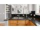 Close-up of the kitchen sink with granite countertops and stylish backsplash at 1261 Ashford Creek Ne Park, Brookhaven, GA 30319