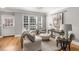 Inviting living room featuring neutral tones, large windows, and stylish decor at 1261 Ashford Creek Ne Park, Brookhaven, GA 30319