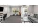 Bright lounge area with a sofa, desk, and view into a meeting area at 1261 Ashford Creek Ne Park, Brookhaven, GA 30319