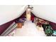 Finished attic with sloped ceilings providing extra space for storage at 1412 Brighton Pl, Loganville, GA 30052