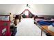 Finished attic space with sloped ceilings, storage and beds at 1412 Brighton Pl, Loganville, GA 30052