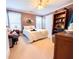 Bedroom featuring a comfortable bed, windows, and ample closet space at 1412 Brighton Pl, Loganville, GA 30052
