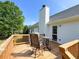 Charming outdoor deck with a table and chairs set, great for relaxing and entertaining at 1412 Brighton Pl, Loganville, GA 30052