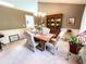 Cozy dining area with classic decor, complemented by a wooden table and a decorative hutch at 1412 Brighton Pl, Loganville, GA 30052