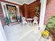Inviting front porch with decorative chairs and a welcoming wreath on the front door at 1412 Brighton Pl, Loganville, GA 30052