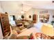 Spacious living room featuring a large sectional sofa, ceiling fan, and access to dining area at 1412 Brighton Pl, Loganville, GA 30052