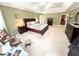 Serene main bedroom suite features a king-size bed, sitting area, and plenty of closet space at 1412 Brighton Pl, Loganville, GA 30052