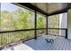 Outdoor balcony featuring black railings and a serene view of nature, perfect for quiet enjoyment of surrounding green trees at 4208 Sierra Creek Ct, Hoschton, GA 30548