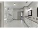 Large bathroom featuring frameless shower, soaker tub, and dual vanity at 4208 Sierra Creek Ct, Hoschton, GA 30548