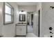 Bathroom with new fixtures, marble tile and an open view to a bedroom at 4208 Sierra Creek Ct, Hoschton, GA 30548