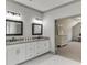 Bathroom with double sinks, white cabinets and a view to the office at 4208 Sierra Creek Ct, Hoschton, GA 30548