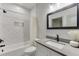 Well-lit bathroom features marble tile and modern black fixtures at 4208 Sierra Creek Ct, Hoschton, GA 30548