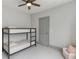 Cozy bedroom with bunk beds, ceiling fan, and neutral color palette at 4208 Sierra Creek Ct, Hoschton, GA 30548