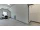 Bright bedroom featuring a neutral color palette, carpeted floors, and a built-in closet, ideal for an office space at 4208 Sierra Creek Ct, Hoschton, GA 30548