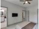 Bedroom offers an ensuite bathroom and mounted television on wall at 4208 Sierra Creek Ct, Hoschton, GA 30548