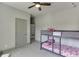 Bedroom with a bunk bed and ceiling fan, creating a cozy atmosphere at 4208 Sierra Creek Ct, Hoschton, GA 30548